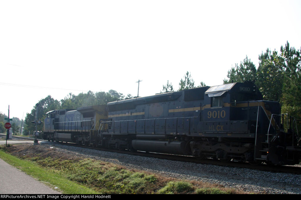 CSX 7815 leads a train towards the yard